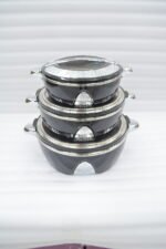Stacked 3-piece black insulated hot pot set with chrome silver accents on a marble kitchen countertop.