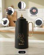 A professional display of three 1-liter Feenik vacuum thermoses in Black, White, and Coffee colors. Each flask features a gold-accented handle, a decorative gold floral print, and a push-to-pour lid, set against a clean kitchen background.