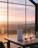 Feenik 2 liter thermal carafe vacuum flask displayed in Coffee, Grey, and White colors, featuring infographics highlighting the glass inside, airtight cap, sleek handle, push-button pouring, and sturdy plastic base.