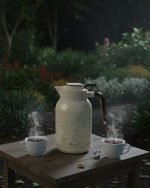 2 litre insulated thermos flask with floral print design, shown in green and white colors. Infographic highlights features including smooth handle, push-to-pour button, stainless steel interior, air-tight cap, and non-slip rubber base.