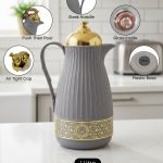 1 Liter luxury vacuum thermos flask with gold top and glass liner, featuring a ribbed body design and push-to-pour button, available in Dark Grey, Grey, and White colors.