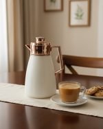 1 Litre vacuum thermos flask with glass liner and push-button pour mechanism, shown in Green, White, and Grey colors for tea and coffee serving.