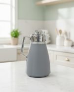 1 Litre vacuum thermos flask with glass liner and push-button pour mechanism, shown in Green, White, and Grey colors for tea and coffee serving.