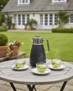 1 Litre vacuum thermos flask with glass liner and push-button pour mechanism, shown in Green, White, and Grey colors for tea and coffee serving.