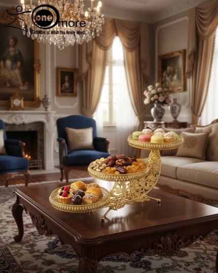 Elevate your entertaining and home decor with this breathtaking Gold Crescent Moon Three-Tier Serving Platter. Crafted with an intricate, scrolled gold-tone metal stand, this unique centerpiece is designed in an artistic crescent-moon shape, supporting three beautifully detailed glass serving bowls. Whether you're presenting candies and chocolates, a selection of dried fruits and nuts, or an array of delicate pastries and desserts (as shown in the images), this decorative stand adds an instant touch of classic luxury and opulence to any setting. Its grand, eye-catching design makes it a perfect focal point for a coffee table, dining table, or buffet. Ideal for holiday gatherings, special occasions, or as a stunning gift for lovers of regal and Victorian-inspired decor.