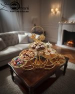 Luxurious gold tiered centerpiece serving stand with desserts and dry fruits on a coffee table. Ornate gold-plated serving tray for dry fruits and sweets. The Opulent Golden Tiered Serving Centerpiece