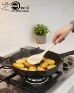 Luxury white marble-look cooking utensil set with rotating holder and rose gold accents. Includes spatula, spoon, and pasta server. Ideal kitchen decor centerpiece.