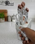 Elevate your kitchen counter with the 'One More' Marble & Rose Gold Knife Set