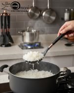 Luxury white marble-look cooking utensil set with rotating holder and rose gold accents. Includes spatula, spoon, and pasta server. Ideal kitchen decor centerpiece.