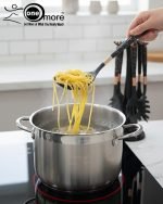 Luxury white marble-look cooking utensil set with rotating holder and rose gold accents. Includes spatula, spoon, and pasta server. Ideal kitchen decor centerpiece.