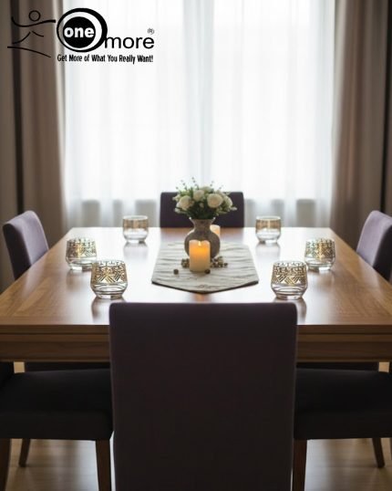 Elegant 7-piece glass beverage set with gold accents including a decanter and six tumblers, shown on a table setting and being used to pour a golden drink.