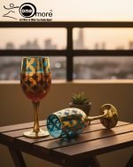 Fancy gold-tone beverage dispenser set with six matching stemmed goblets. The dispenser and glasses have a repeating geometric lattice pattern available in white and gold, blue and gold, or red and gold.