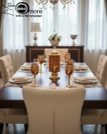 Fancy gold-tone beverage dispenser set with six matching stemmed goblets. The dispenser and glasses have a repeating geometric lattice pattern available in white and gold, blue and gold, or red and gold.