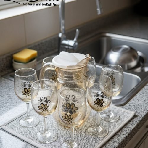 Elegant 7-piece glass water set by One More featuring one amber glass pitcher and six matching goblets, all decorated with a black and gold tulip design.