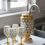 Royal Honeycomb beverage dispenser set with gold base and stemmed goblets in multiple colors (Red, Blue, White).