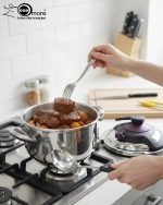 Premium 5-liter stainless steel Turkish pressure cooker with a purple lid and handle, shown cooking meat and vegetables on a stovetop.