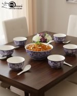 14-piece ceramic soup and ramen bowl set in four color variations: light blue, warm beige, sunset orange, and deep violet marble patterns, all including ceramic spoons and a large serving bowl.