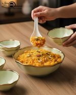 Elegant 14-piece ceramic soup set in six available colors (Black, Navy Blue, Taupe, Slate Grey, Dark Green, Mint Green) featuring scalloped gold rims; includes 1 large serving bowl, 6 small soup bowls, 1 serving spoon, and 6 individual soup spoons, displayed on a kitchen countertop.