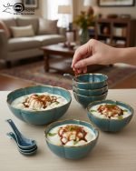 14-piece ceramic soup bowl and spoon set featuring a large serving bowl, six individual bowls, and seven matching spoons, all with a rich color glaze and elegant hand-painted gold rim, available in five colors: black, green, white, taupe, and deep teal.