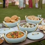 Elegant insulated casserole dish set with gold accents for serving hot food, available in white, sky blue, and blue in 2.5, 3, and 3.5-liter sizes.