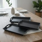 Set of 3 rectangular fiber serving trays in black, brown, and white colors, featuring non-slip texture and ergonomic handles for serving food and beverages.