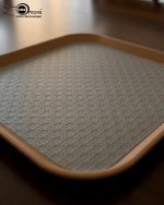 Set of 3 non-slip fiber serving trays in grey and rust brown colors.