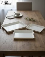 Set of 3 rectangular fiber serving trays in black, brown, and white colors, featuring non-slip texture and ergonomic handles for serving food and beverages.