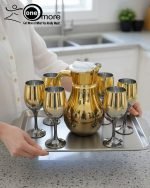 Luxury painted glass water set: 1 jug, 6 stemmed glasses with gold and vibrant color metallic finish.