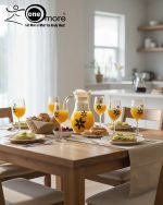 Elegant 7-piece glass water set by One More featuring one amber glass pitcher and six matching goblets, all decorated with a black and gold tulip design.