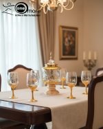 Gold and color-accented honeycomb pattern beverage dispenser and six matching wine glasses set. Available colors include white, teal, emerald green, and navy blue.