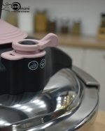 Premium 5-liter stainless steel Turkish pressure cooker with a purple lid and handle, shown cooking meat and vegetables on a stovetop.