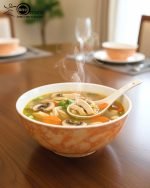 14-piece ceramic soup and ramen bowl set in four color variations: light blue, warm beige, sunset orange, and deep violet marble patterns, all including ceramic spoons and a large serving bowl.