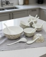 14-piece ceramic soup and ramen bowl set in four color variations: light blue, warm beige, sunset orange, and deep violet marble patterns, all including ceramic spoons and a large serving bowl.