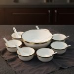 14-piece ceramic soup and ramen bowl set in four color variations: light blue, warm beige, sunset orange, and deep violet marble patterns, all including ceramic spoons and a large serving bowl.