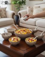 14-piece ceramic soup bowl and spoon set featuring a large serving bowl, six individual bowls, and seven matching spoons, all with a rich color glaze and elegant hand-painted gold rim, available in five colors: black, green, white, taupe, and deep teal.