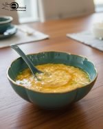 14-piece ceramic soup bowl and spoon set featuring a large serving bowl, six individual bowls, and seven matching spoons, all with a rich color glaze and elegant hand-painted gold rim, available in five colors: black, green, white, taupe, and deep teal.