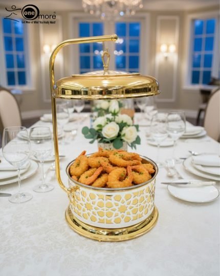 Royal gold and silver chafing dish for buffet service, featuring an ornate laser-cut pattern and a high gold stand with a hinged lid. Available in 4 and 6 liter capacities, designed for catering, weddings, and high-end events to keep foods like biryani, curry, or fried shrimp warm.