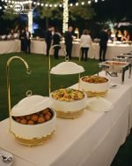 Luxury Royal buffet server set in black and gold color, a 6-liter chafing dish used for serving crispy fried shrimp at a formal dinner table, featuring an elegant golden stand and an overhead lid. The base includes a holder for canned heat or a buffet burner.