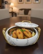 A set of three stacked white marble-patterned insulated casserole dishes (hot pots) with striking gold-tone handles and lids, displayed on a formal dining table.