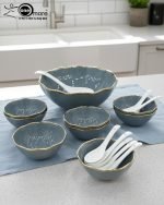 Elegant 14-piece ceramic soup set in six available colors (Black, Navy Blue, Taupe, Slate Grey, Dark Green, Mint Green) featuring scalloped gold rims; includes 1 large serving bowl, 6 small soup bowls, 1 serving spoon, and 6 individual soup spoons, displayed on a kitchen countertop.