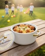 A stacked set of three premium insulated hot pots (1L, 2L, 3.5L) in a crisp white color with decorative gold-toned handles, shown on a marble kitchen countertop. The set features clear acrylic lids and is marketed for keeping food warm.