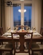 Elegant 7-piece glass water set by One More featuring one amber glass pitcher and six matching goblets, all decorated with a black and gold tulip design.