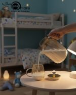 Full 7-piece amber glass water or tea set displayed on a wooden dining table with place mats and six matching cups.