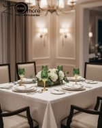 Fancy gold-tone beverage dispenser set with six matching stemmed goblets. The dispenser and glasses have a repeating geometric lattice pattern available in white and gold, blue and gold, or red and gold.