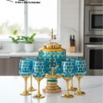 Gold and color-accented honeycomb pattern beverage dispenser and six matching wine glasses set. Available colors include white, teal, emerald green, and navy blue.