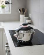 Premium 5-liter stainless steel Turkish pressure cooker with a purple lid and handle, shown cooking meat and vegetables on a stovetop.