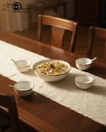 14-piece ceramic soup and ramen bowl set in four color variations: light blue, warm beige, sunset orange, and deep violet marble patterns, all including ceramic spoons and a large serving bowl.