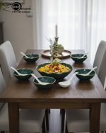 Elegant 14-piece ceramic soup set in six available colors (Black, Navy Blue, Taupe, Slate Grey, Dark Green, Mint Green) featuring scalloped gold rims; includes 1 large serving bowl, 6 small soup bowls, 1 serving spoon, and 6 individual soup spoons, displayed on a kitchen countertop.