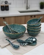 14-piece ceramic soup bowl and spoon set featuring a large serving bowl, six individual bowls, and seven matching spoons, all with a rich color glaze and elegant hand-painted gold rim, available in five colors: black, green, white, taupe, and deep teal.