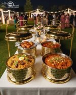 Royal gold and silver chafing dish for buffet service, featuring an ornate laser-cut pattern and a high gold stand with a hinged lid. Available in 4 and 6 liter capacities, designed for catering, weddings, and high-end events to keep foods like biryani, curry, or fried shrimp warm.